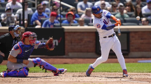 New York Mets' Eduardo Escobar hits an RBI triple during the second inning of a baseball game against the St. Louis Cardinals at Citi Field, Sunday, June 18, 2023, in New York. (AP Photo/Seth Wenig)