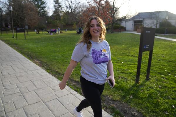 Brianna McCullough, 20, a sophomore at Chatham University in Pittsburgh, walks through campus on Thursday, Nov. 10, 2022. Support for abortion rights did drive women to the polls in Tuesday's elections. But for many, the issue took on higher meaning, part of an overarching concern about the future of democracy. "If they can take this away, they can take anything away from people. And I don't think that's right." McCullough said.(AP Photo/Gene J. Puskar)