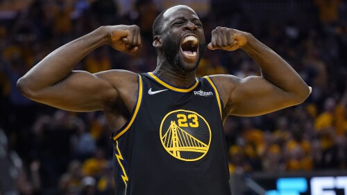 FILE - Golden State Warriors forward Draymond Green celebrates after scoring against the Dallas Mavericks in the second half of Game 5 of the NBA basketball playoffs Western Conference finals in San Francisco, Thursday, May 26, 2022. The Warriors want to keep Green, however, the team is prepared for him to formally decline his $27.5 million player option for the final year of his contract next season and become an unrestricted free agent seeking a long-term deal.  (AP Photo/Jeff Chiu, File)