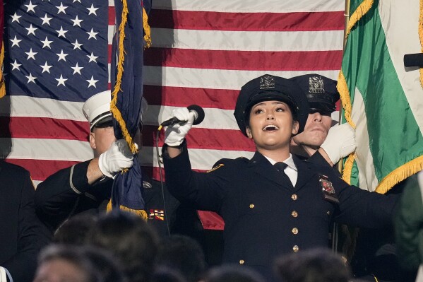 New York Police officer Brianna Fernandez sings the national anthem before an NFL football game between the New York Jets and the Buffalo Bills, Monday, Sept. 11, 2023, in East Rutherford, N.J. (AP Photo/Seth Wenig)