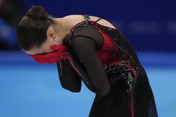 FILE - Kamila Valieva, of the Russian Olympic Committee, reacts after the women's free skate program during the figure skating competition at the 2022 Winter Olympics, Thursday, Feb. 17, 2022, in Beijing. Eight months after finishing behind the Russians at the Winter Games, the U.S. team has yet to receive its medals, or even know whether they will be silver or gold. That’s because only recently did the Russian Anti-Doping Agency complete its painfully slow investigation into Kamila Valieva, the now-16-year-old whose positive doping test that surfaced during the opening week of the Olympics led to its biggest scandal in years. (AP Photo/Bernat Armangue, File)