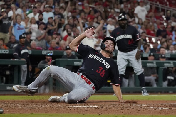 Minnesota Twins' Matt Wallner scores during the seventh inning of a baseball game against the St. Louis Cardinals Tuesday, Aug. 1, 2023, in St. Louis. (AP Photo/Jeff Roberson)