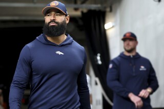 Broncos assistant coach Michael Wilhoite arrested after being accused of  punching a police officer | AP News