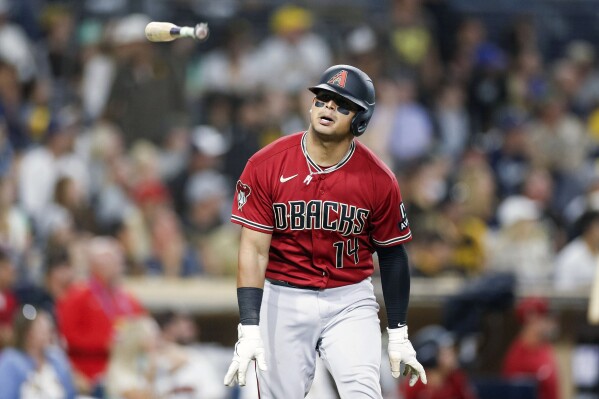 Arizona Diamondbacks' Gabriel Moreno tosses his bat after hitting a grand slam during the seventh inning in the second baseball game of a doubleheader against the San Diego Padres, Saturday, Aug 19, 2023, in San Diego. (AP Photo/Brandon Sloter)