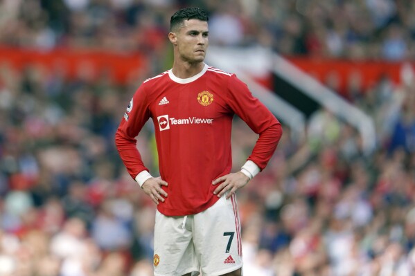 FILE - Manchester United's Cristiano Ronaldo stands on the pitch during the team's English Premier League soccer match against Norwich City on April 16, 2022, in Manchester, England. Lawyers for Ronaldo are headed back to court in a legal battle over the hush money he paid to a woman who accused him of raping her in Las Vegas in 2009. A three-judge panel of the 9th U.S. Circuit Court of Appeals has scheduled oral arguments Wednesday, Oct. 4, on the woman's bid to overturn last year's dismissal of the civil suit. (AP Photo/Jon Super, File)