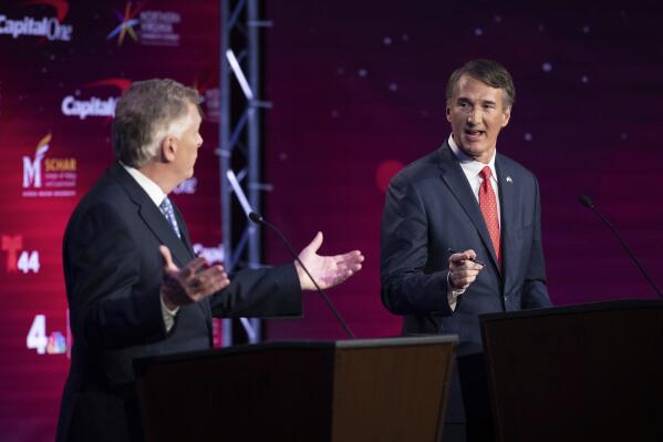 Virginia Democratic gubernatorial candidate and former Gov. Terry McAuliffe, left, and Republican challenger, Glenn Youngkin, participate in their debate at Northern Virginia Community College, in Alexandria, Va., Tuesday, Sept. 28, 2021. (AP Photo/Cliff Owen)