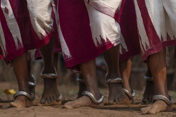 Members of the Durua tribe, part of India's Indigenous Adivasis communities, perform traditional dances during the Chaitra Parab festival, a month long harvest celebration in Hatipakna village, Koraput district, in India's eastern state of Odisha, Thursday, April 17, 2025. (AP Photo/Rafiq Maqbool)