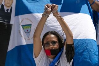 FILE - Nicaragua supporters protest outside of the Organization of the American States asking that political prisoners be freed and against the government's human rights violations, during a rally in Washington, June 23, 2021. Nicaragua has increased human rights violations and persecution of the opposition as it ratchets up its efforts to stifle dissent, a United Nations group of experts monitoring the country said Tuesday, Sept. 12, 2023. (AP Photo/Jose Luis Magana, File)