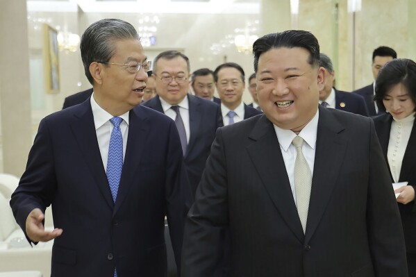In this photo provided by the North Korean government, North Korean leader Kim Jong Un, right, meets Zhao Leji, chairman of the National People’s Congress of China, in Pyongyang, North Korea Saturday, April 13, 2024. Independent journalists were not given access to cover the event depicted in this image distributed by the North Korean government. The content of this image is as provided and cannot be independently verified. (Korean Central News Agency/Korea News Service via AP)