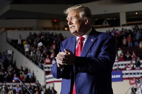 Republican presidential candidate former President Donald Trump gestures as he leaves a campaign rally Saturday, July 29, 2023, in Erie, Pa. (AP Photo/Sue Ogrocki)