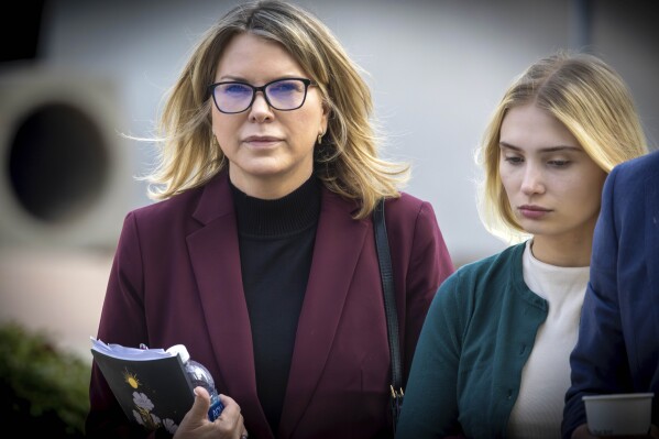 Rebecca Grossman, left, and daughter heads to Van Nuys Courthouse in the Van Nuys section of Los Angeles on Feb. 14, 2024. The Southern California socialite was found guilty Friday, Feb. 23, 2024 of murder and other charges in the hit-and-run deaths of two young brothers in a crosswalk more than three years ago. (Irfan Khan/Los Angeles Times via AP)