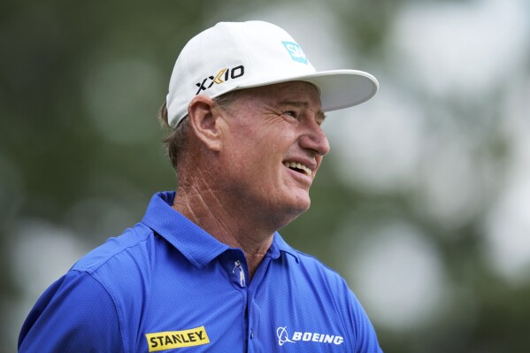 Ernie Els watches his shot off the tenth tee during the final round of the Champions Tour Principal Charity Classic golf tournament, Sunday, June 2, 2024, in Des Moines, Iowa. (AP Photo/Charlie Neibergall)