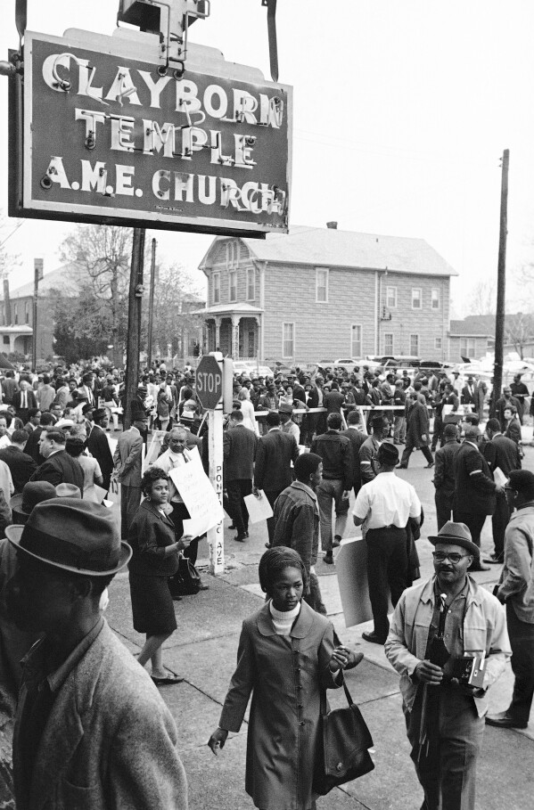 People gather at the Clayborn Temple as they prepare to march in honor of Dr. Martin Luther King in Memphis, Tenn., on April 8, 1968, four days after the civil rights leader was assassinated. (AP Photo/File)