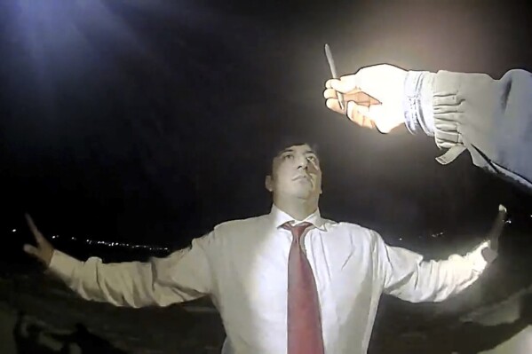 Body camera video captured North Dakota Republican lawmaker Nico Rios using profanity and homophobic slurs toward Williston police officers and threatening to call the state’s attorney general during a DUI stop on Dec. 5, 2023, in Williston, N.D. Rios said he was leaving a Christmas party before the traffic stop. (Williston Police Dept. via AP)