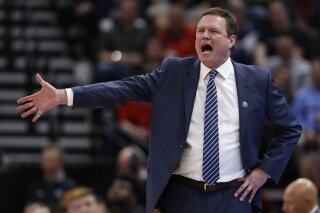 FILE - In this March 21, 2019, file photo, Kansas head coach Bill Self reacts in the first half during a first round men's college basketball game against Northeastern in the NCAA Tournament in Salt Lake City. A person familiar with the situation says the University of Kansas received a notice of allegations from the NCAA on Monday, Sept. 23, 2019, that alleges significant violations within its storied men's basketball program.
The person spoke to The Associated Press on condition of anonymity because neither the NCAA nor the school had announced the notice, which was first reported by Yahoo Sports. That initial report, citing unnamed sources, said the notice included three Level 1 violations tied primarily to recruiting, lack of institutional control and a responsibility charge leveled against Hall of Fame coach Self. (AP Photo/Jeff Swinger, File)