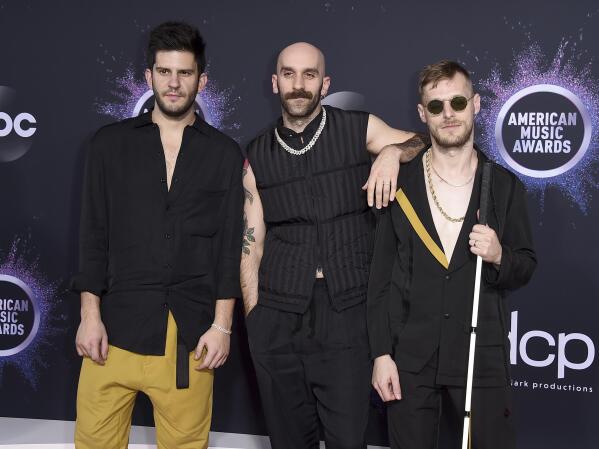FILE - Adam Levin, from left, Sam Harris, and Casey Harris, of X Ambassadors, appear at the American Music Awards in Los Angeles on Nov. 24, 2019. The band's latest album "The Beautiful Liar," released Friday. (Photo by Jordan Strauss/Invision/AP)