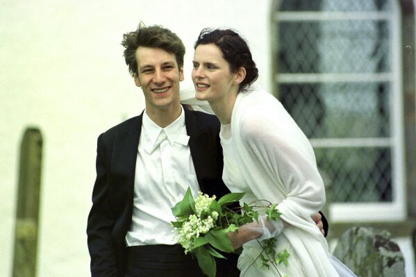 FILE  In this May 22, 1999 file photo, Stella Tennant with French born David Lasnet on their wedding day in Oxnam, on the Scottish Borders. Tennant, the aristocratic British model who was a muse to designers including Karl Lagerfeld and Gianni Versace, has died suddenly at the age of 50, her family said Wednesday, Dec. 23, 2020. The family asked for their privacy to be respected and said Tennant was “a wonderful woman and an inspiration to us all.” Police Scotland said there were no suspicious circumstances.  (David Cheskin/PA via AP, FIle)