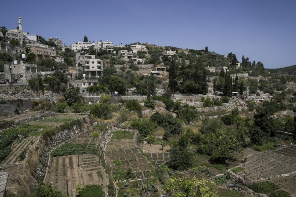 A view of the West Bank village of Battir, whose terraces are a UNESCO cultural landscape, Sunday, June 4, 2023. Environmental groups say an Israeli settlement project slated for a nearby hilltop could threaten the ancient terraces of the village, which has been recognized as a UNESCO world heritage site. (AP Photo/Mahmoud Illean)