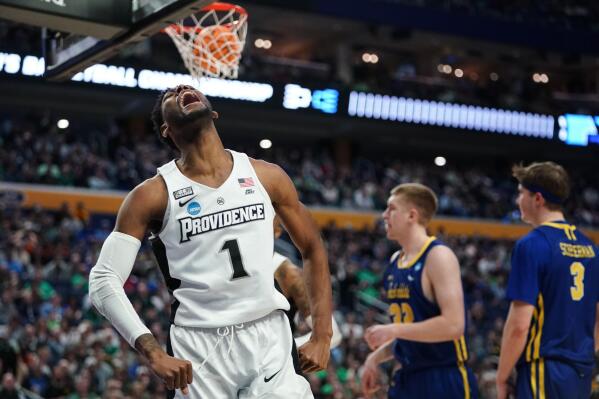 Providence's Al Durham (1) celebrates after drawing a foul while scoring in the second half of a college basketball game against South Dakota State during the first round of the NCAA men's tournament Thursday, March 17, 2022, in Buffalo, N.Y. Providence won 66-57. (AP Photo/Frank Franklin II)