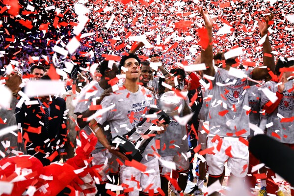 St. John's guard RJ Luis Jr. celebrates with teammates after winning the Big East Conference regular season title after they defeated Seton Hall in an NCAA college basketball game, Saturday, March 1, 2025, in New York. (AP Photo/Noah K. Murray)
