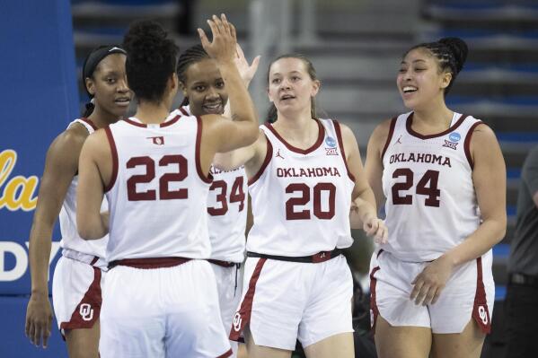 Oklahoma players celebrate a basket by guard Aubrey Joens (20) during the second half of the team's first-round college basketball game against Portland in the women's NCAA Tournament, Saturday, March 18, 2023, in Los Angeles. (AP Photo/Kyusung Gong)