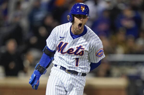 New York Mets Jeff McNeil (1) reacts as he heads up the first base line after hitting a two-run double against the San Diego Padres during the seventh inning of Game 2 of a National League wild-card baseball playoff series, Saturday, Oct. 8, 2022, in New York. (AP Photo/John Minchillo)