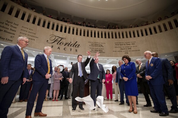 The traditional "Sine die" hanky drop signifies the end of the 2024 Florida Legislative Session, Friday, March 8, 2024, in Tallahassee, Fla. (Alicia Devine/Tallahassee Democrat via AP)