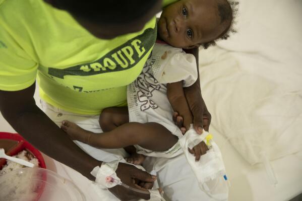 A baby stricken with cholera receives treatment at a clinic run by Doctors Without Borders in Port-au-Prince, Haiti, Friday, Nov. 11, 2022. (AP Photo/Odelyn Joseph)