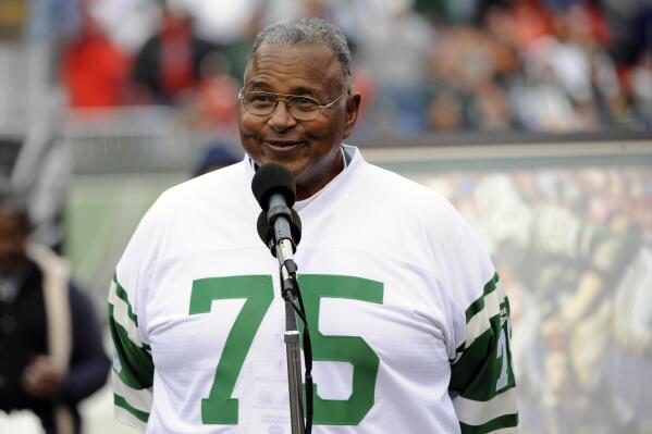 FILE - In this Nov. 1, 2009, file photo, former New York Jets offensive lineman Winston Hill is honored during halftime of an NFL football game in East Rutherford, N.J. The late Hill, who died in 2016, was posthumously selected last year for the centennial class of the Pro Football Hall of Fame after a 15-year career during which he established himself as a durable force on the offensive line — and a favorite of his teammates. (AP Photo/Bill Kostroun, File)