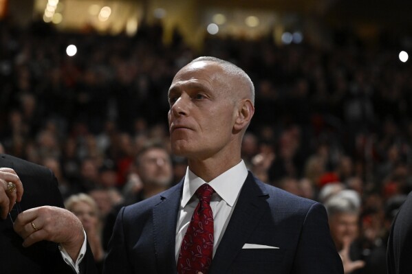Big 12 Commissioner Brett Yormark stands on the sideline before an NCAA college basketball game between Texas Tech and Houston Monday, Feb. 24, 2025, in Lubbock, Texas. (AP Photo/Justin Rex, File)