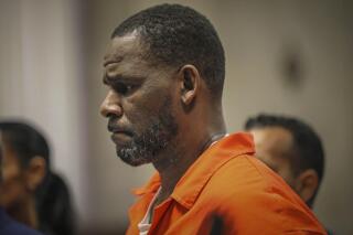 FILE - In this Sept. 17, 2019, file photo, R. Kelly appears during a hearing at the Leighton Criminal Courthouse in Chicago. The R&B star gained weight and lost money while he awaits a sex-trafficking trial that starts in earnest next week, his lawyers said Tuesday, Aug. 3, 2021, at a court hearing. The revelations came as U.S. District Judge Ann M. Donnelly in New York made a series of rulings to narrow down what evidence can be shown to jurors. (Antonio Perez/Chicago Tribune via AP, Pool, File)