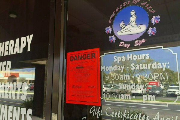 FILE - This Feb. 19, 2019, file photo, shows the Orchids of Asia Day Spa in Jupiter, Fla. The Associated Press has obtained a video that shows detectives trying to persuade a Chinese masseuse to describe herself as a victim of human trafficking. The outcome of her interview would help determine whether Martin County could prove the owners of five massage parlors its deputies raided are not just pimps, but human traffickers holding women against their will. (Hannah Morse/Palm Beach Post via AP, File)