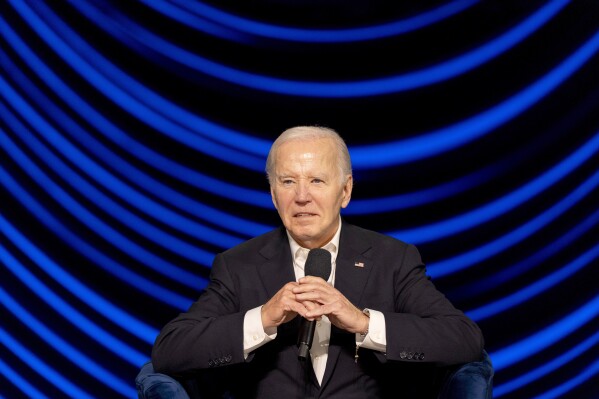 President Joe Biden is seated during a campaign event with former President Barack Obama moderated by Jimmy Kimmel at the Peacock Theater, Saturday, June 15, 2024, in Los Angeles. (AP Photo/Alex Brandon)