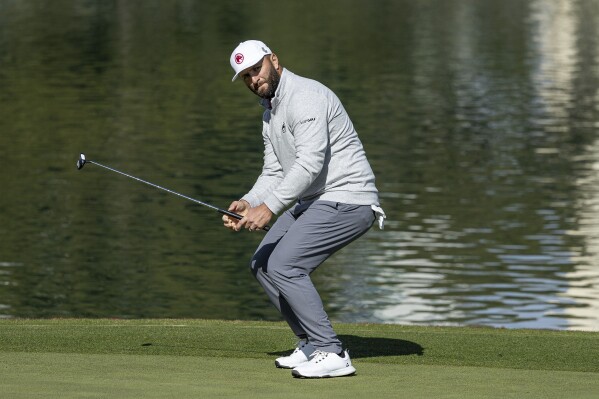 Jon Rahm reacts to his putt on the ninth green during the second round of LIV Golf Las Vegas at Las Vegas Country Club on Friday, Feb. 9, 2024, in Las Vegas. (Doug DeFelice/LIV Golf via AP)