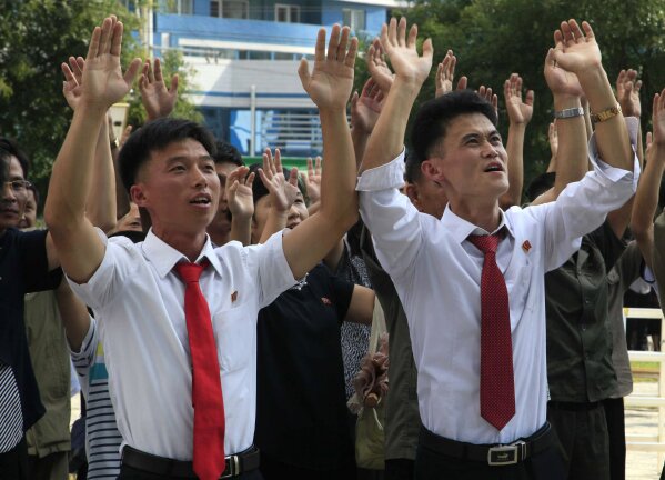 
              FILE - In this Sept. 3, 2017 file photo, people react to the news of their country's latest nuclear test, at the Mirae Scientists Street in Pyongyang, North Korea.  North Korea said it successfully detonated a hydrogen bomb in its latest nuclear test Sunday, Sept. 3, 2017. Outside experts haven’t been able to verify that claim, but say it’s plausible. If true, it would represent a major step forward in North Korea’s effort to develop a nuclear weapon capable of reaching the United States. (AP Photo/Kim Kwang Hyon, File)
            