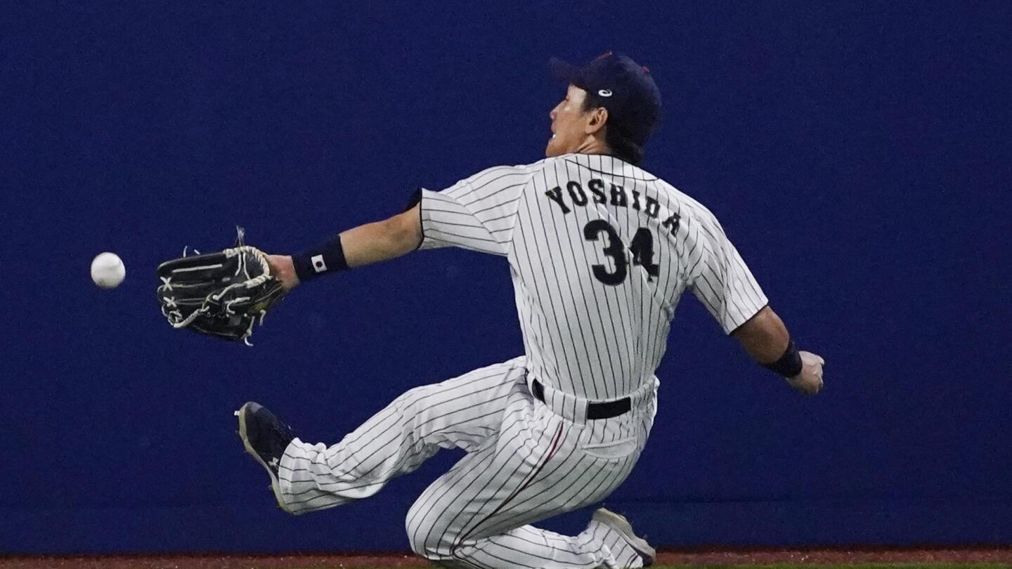 File photo taken in December 2006 shows Japanese pitcher Daisuke Matsuzaka  holding his jersey and cap during an introductory press conference with the Red  Sox in Boston. The two-time World Baseball Classic