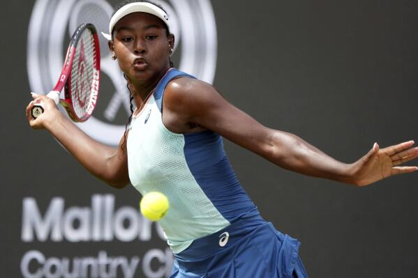 FILE - Alycia Parks from the United States returns the ball to Ons Jabeur from Tunisia during their WTA tournament round of 16 tennis match in Berlin, Germany, June 16, 2022. On Sunday, Feb. 5, 2023, Parks secured a stunning 7-6 (7), 7-5 upset win over WTA Finals champion Caroline Garcia in the Open Métropole de Lyon final to clinch her first career title. (AP Photo/Michael Sohn, File)