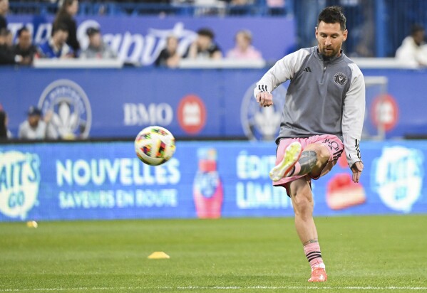 Inter Miami's Lionel Messi warms up for the team's MLS soccer match against CF Montreal on Saturday, May 11, 2024, in Montreal. (Graham Hughes/The Canadian Press via AP)