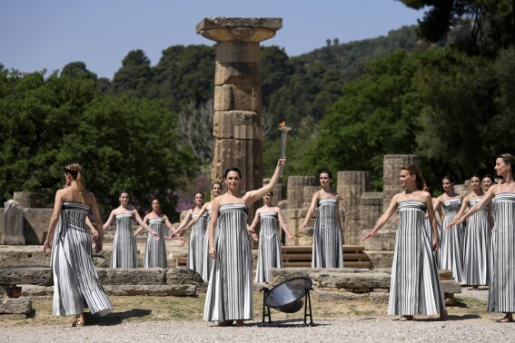 Performers take part in the final dress rehearsal of the flame lighting ceremony for the Paris Olympics, at the Ancient Olympia site, Greece, Monday, April 15, 2024. The flame for the Paris Olympics will be officially lit Tuesday at the birthplace of the ancient games, and will then be carried through Greece for 11 days before being handed over to Paris organizers on April 26. (AP Photo/Thanassis Stavrakis)