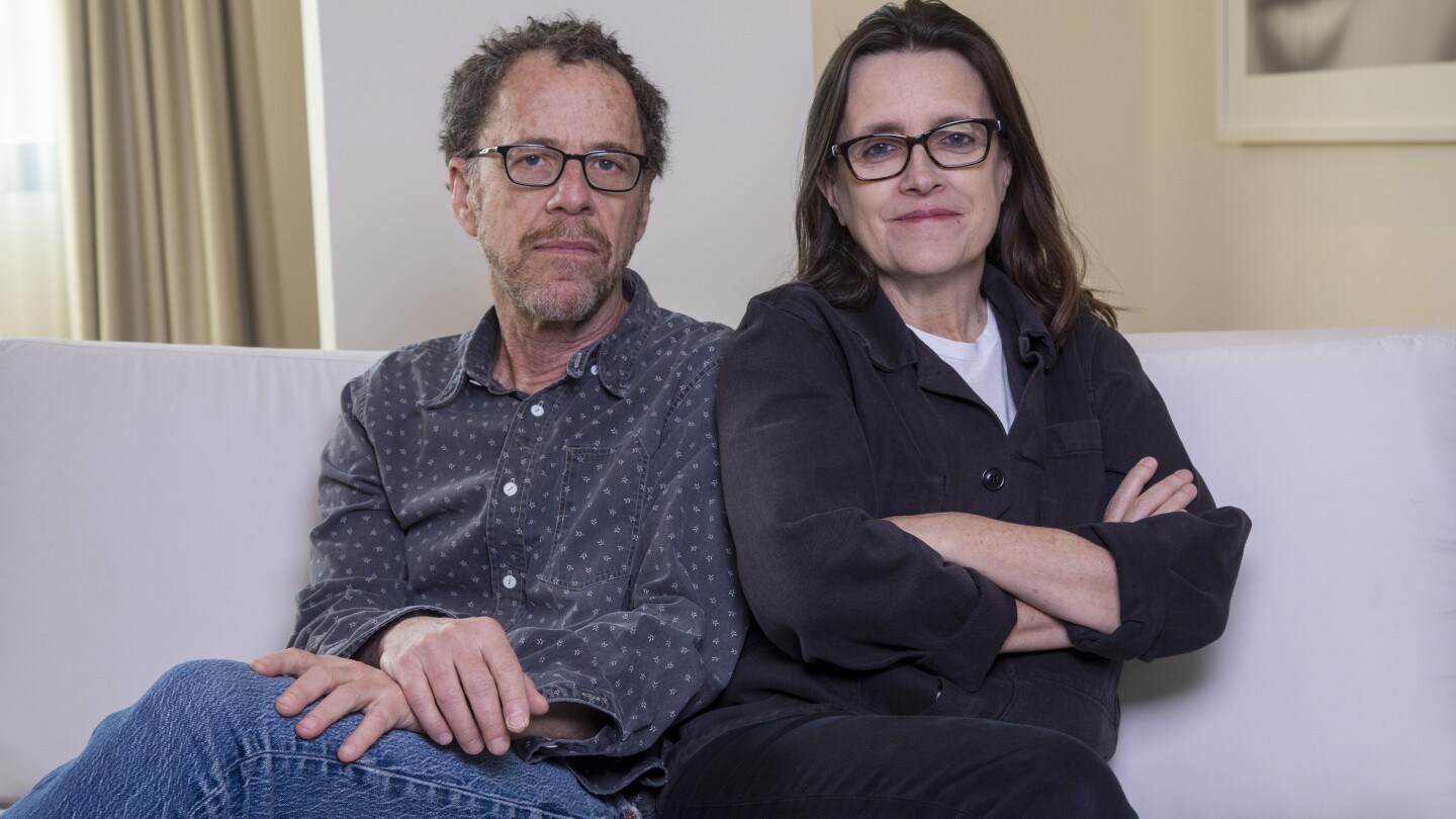 Writer/director Ethan Coen, left, and writer Tricia Cooke pose for a portrait to promote "Drive-Away Dolls" on Tuesday, Feb. 20, 2024, in New York. (Photo by Andy Kropa/Invision/AP)
