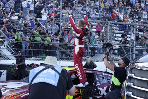 William Byron celebrates after winning a NASCAR Cup Series auto race at Martinsville Speedway in Martinsville, Va., Sunday, April 7, 2024. (AP Photo/Chuck Burton)