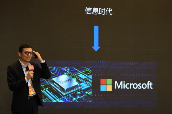 A presenter talks about Microsoft in the Information Age during the World Artificial Intelligence Conference in Shanghai, Thursday, July 6, 2023. A China-based hacking group has breached email accounts linked to government agencies in Western Europe, Microsoft Corp. said in a blog post published Tuesday, July 11. (AP Photo/Ng Han Guan)