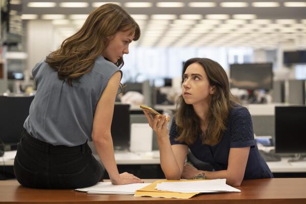This image released by Universal Pictures shows Carey Mulligan as Megan Twohey, left, and Zoe Kazan as Jodi Kantor in a scene from "She Said." (JoJo Whilden/Universal Pictures via AP)