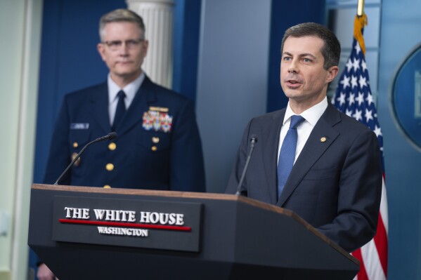 Coast Guard Deputy Commandant for Operations Vice Admiral Peter Gautier listens as Transportation Secretary Pete Buttigieg speaks about the Francis Scott Key bridge collapse during a press briefing at the White House, Wednesday, March 27, 2024, in Washington. (AP Photo/Evan Vucci)