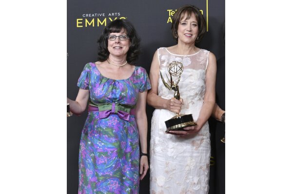 FILE - Julie Cohen, left, and Betsy West pose in the press room with their awards for exceptional merit in documentary filmmaking for "RBG" at the Creative Arts Emmy Awards in Los Angeles on Sept. 14, 2019. Their latest project, "My Name is Pauli Murray" is an official selection of the Premieres section at the 2021 Sundance Film Festival. (Photo by Richard Shotwell/Invision/AP, File)