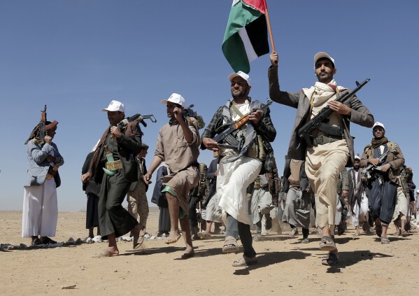 Houthi fighters march during a rally of support for the Palestinians in the Gaza Strip and against the U.S. strikes on Yemen outside Sanaa on Jan. 22, 2024.  (AP Photo)