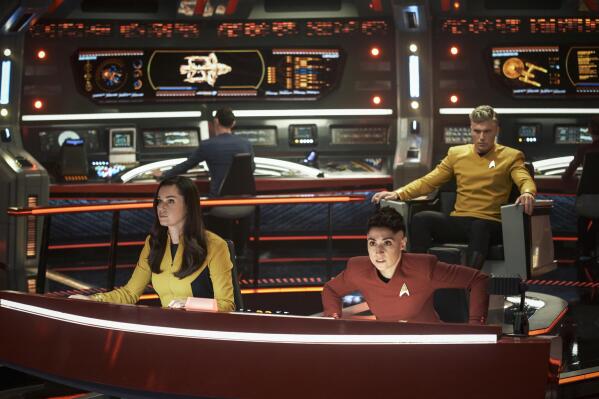 This image released by Paramount+ shows, from left, Rebecca Romijn as Una, Ethan Peck as Spock, background, Melissa Navia as Ortegas and Anson Mount as Pike in a scene from the series "Star Trek: Strange New Worlds." (Marni Grossman/Paramount+ via AP)