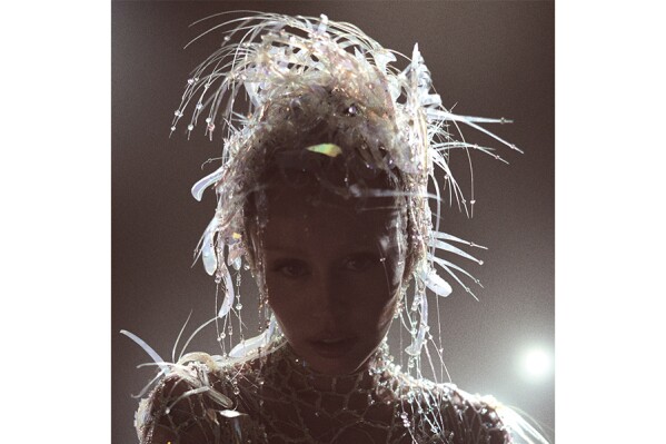 This album cover image released by Columbia Records shows "Something Beautiful" by Miley Cyrus. (Columbia Records via AP)