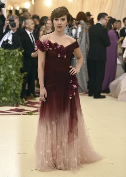 
              FILE - In this May 7, 2018 file photo, Scarlett Johansson wears a Marchesa gown at The Metropolitan Museum of Art's Costume Institute benefit gala in New York.  Marchesa co-founder Georgina Chapman, Harvey Weinstein’s estranged wife, has given a tearful interview in Vogue magazine which she says she never knew of her husband’s misconduct. The interview comes a day after Wintour came out in support of Chapman on Stephen Colbert’s late-night show, "Late Night with Stephen Colbert" and a few days after Johansson wore a gown by Marchesa at the Met Gala.  (Photo by Evan Agostini/Invision/AP, File)
            