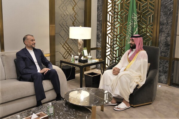 In this picture released by the Iranian Foreign Ministry, Iran's Foreign Minister Hossein Amirabdollahian, left, meets with Saudi Arabia's Crown Prince Mohammed bin Salman in Jeddah, Saudi Arabia, Friday, Aug. 18, 2023. Iran's foreign minister traveled to Saudi Arabia on Thursday, marking the first trip to the kingdom by Tehran's top diplomat in years after the two nations reached a détente with Chinese mediation. (Iranian Foreign Ministry via AP)